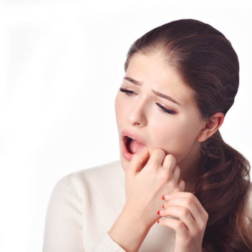 Dental care and toothache.Teeth Problem. Woman Feeling Tooth Pain. Closeup Of Beautiful Sad Girl Suffering From Strong Tooth Pain. Attractive Female Feeling Painful Toothache. Dental Health And Care